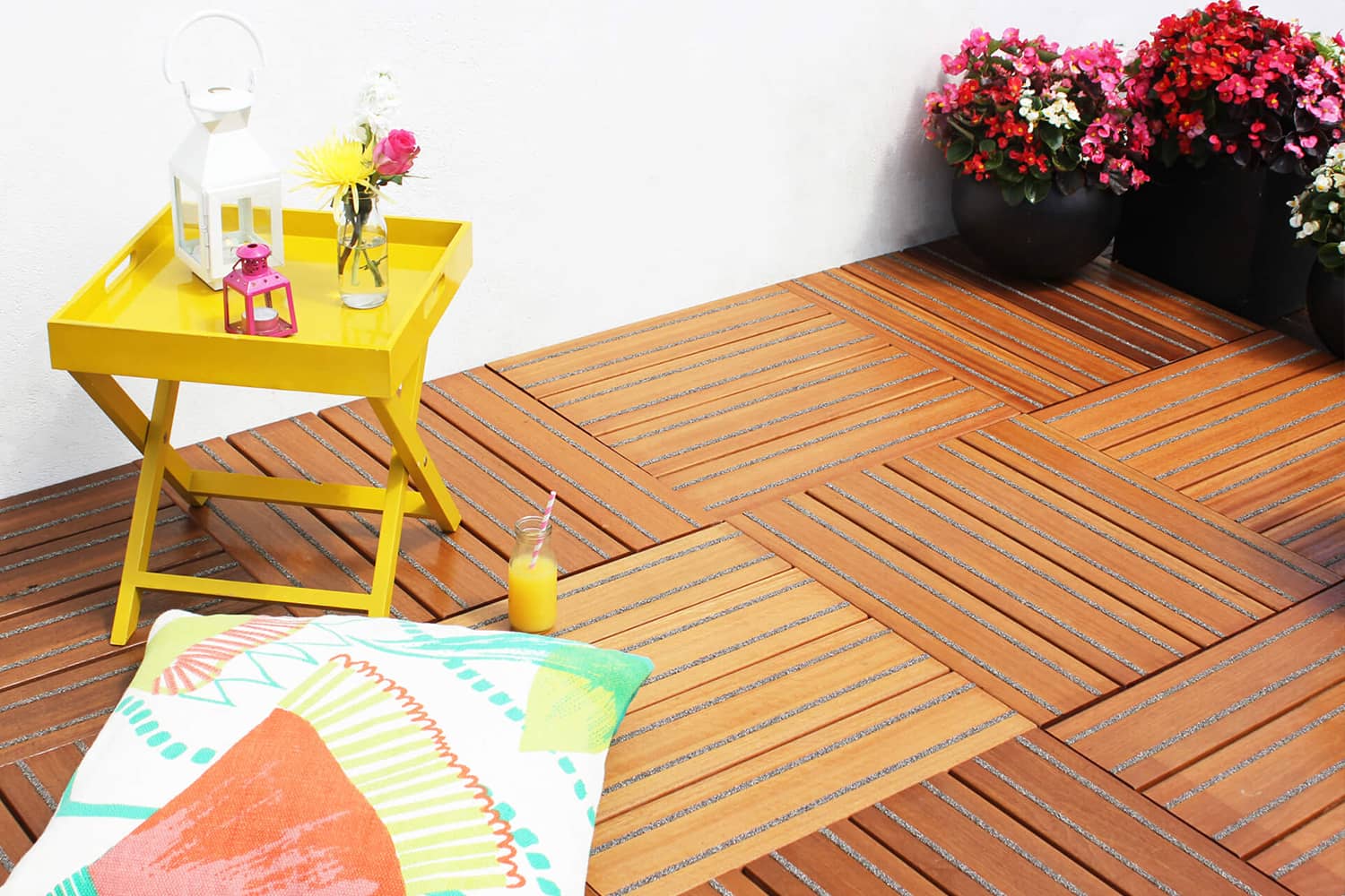 Colourful garden furniture on hardwood non-slip decking tiles