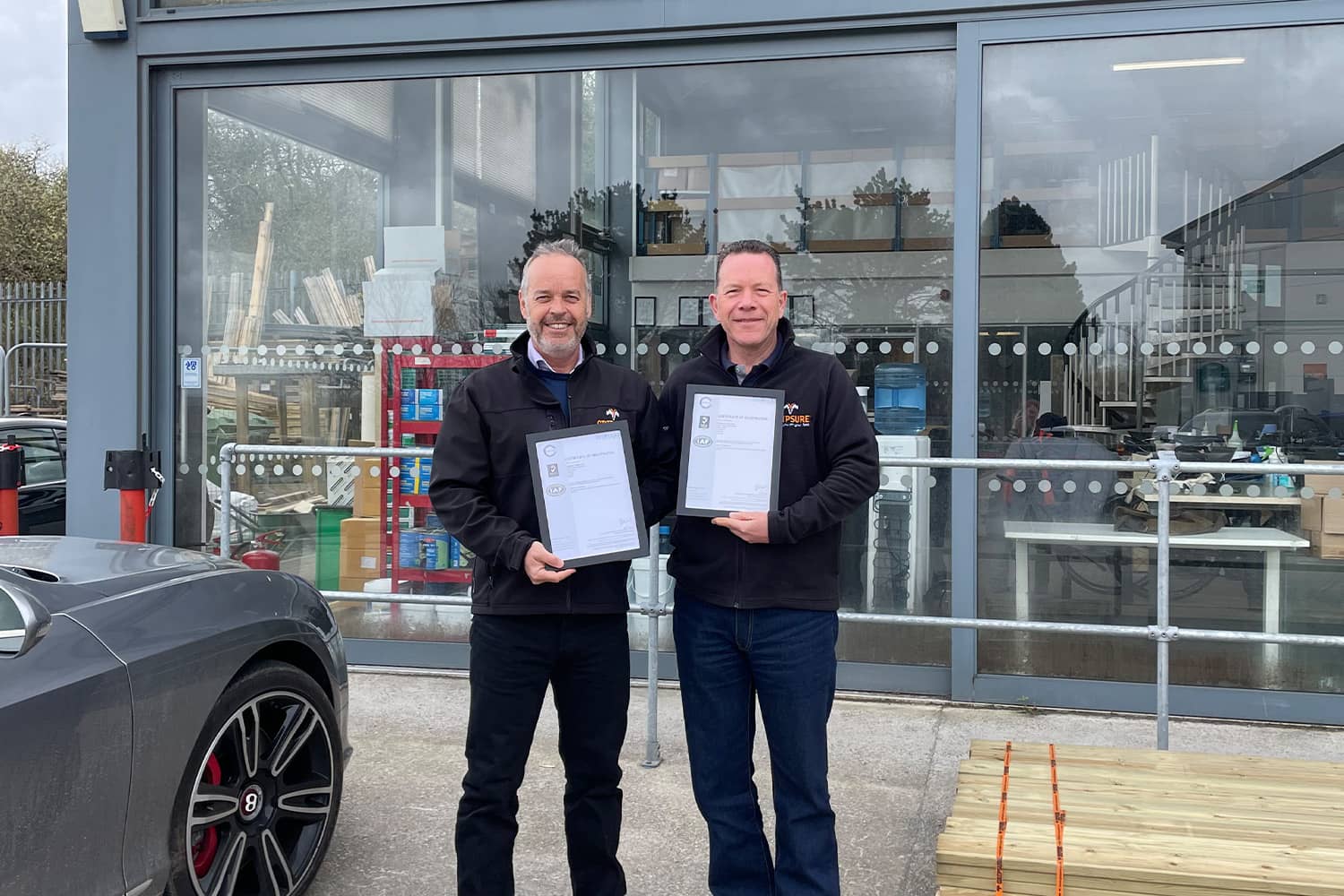 Mike Nicholson and Robin Olver celebrate double ISO accreditation